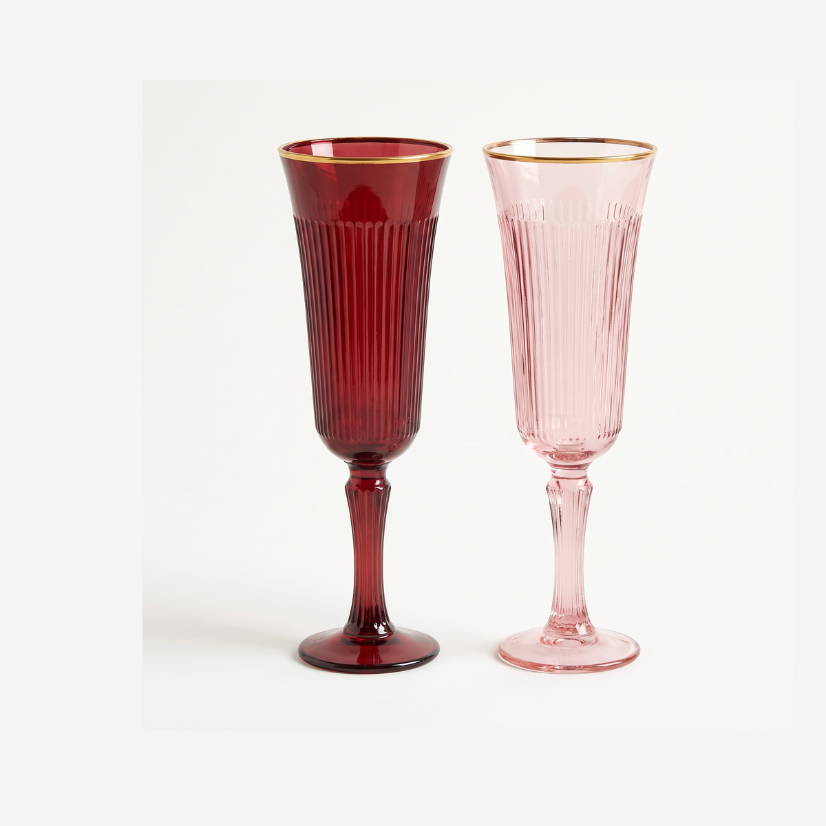 J-Line Champagneglas Reliëf Gouden Rand Groot Bordeaux/Lichtroze Assorti - 2 Stuks leeg op gebroken witte achtergrond